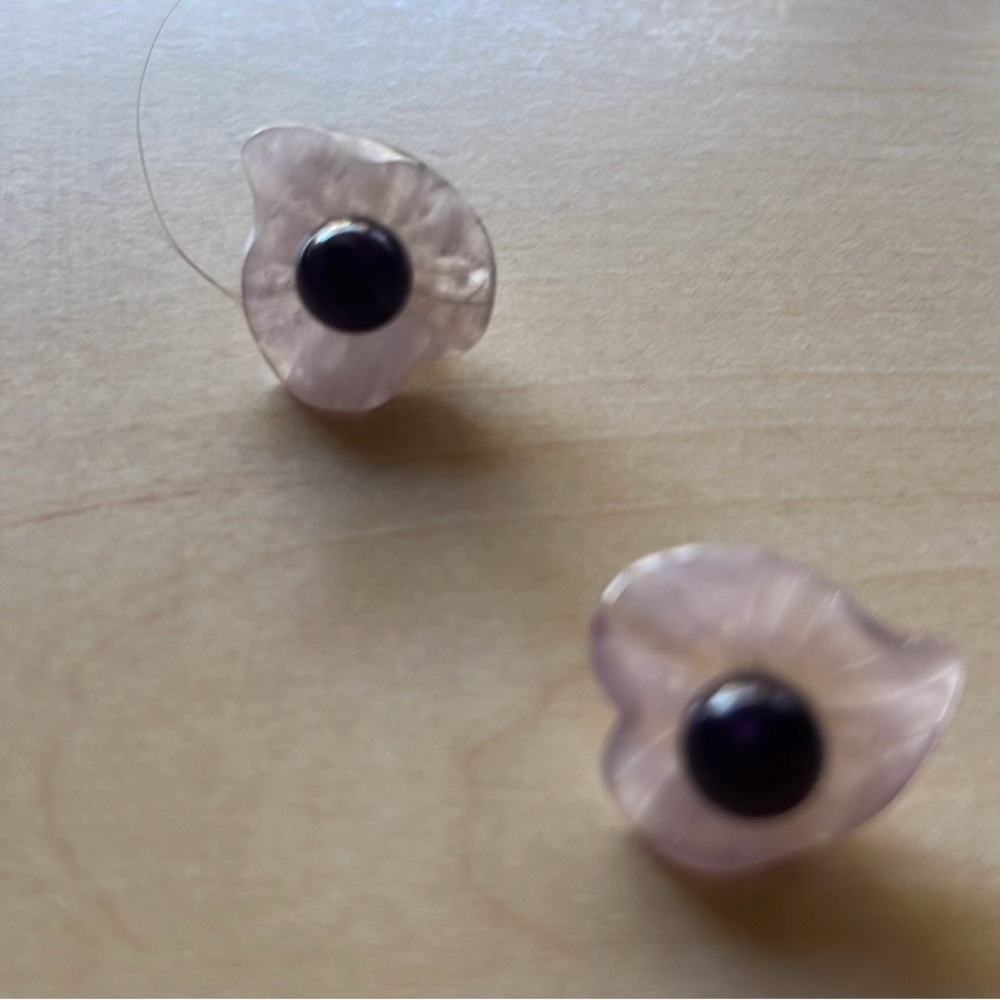 Amethyst stud earrings with paler amethyst jackets